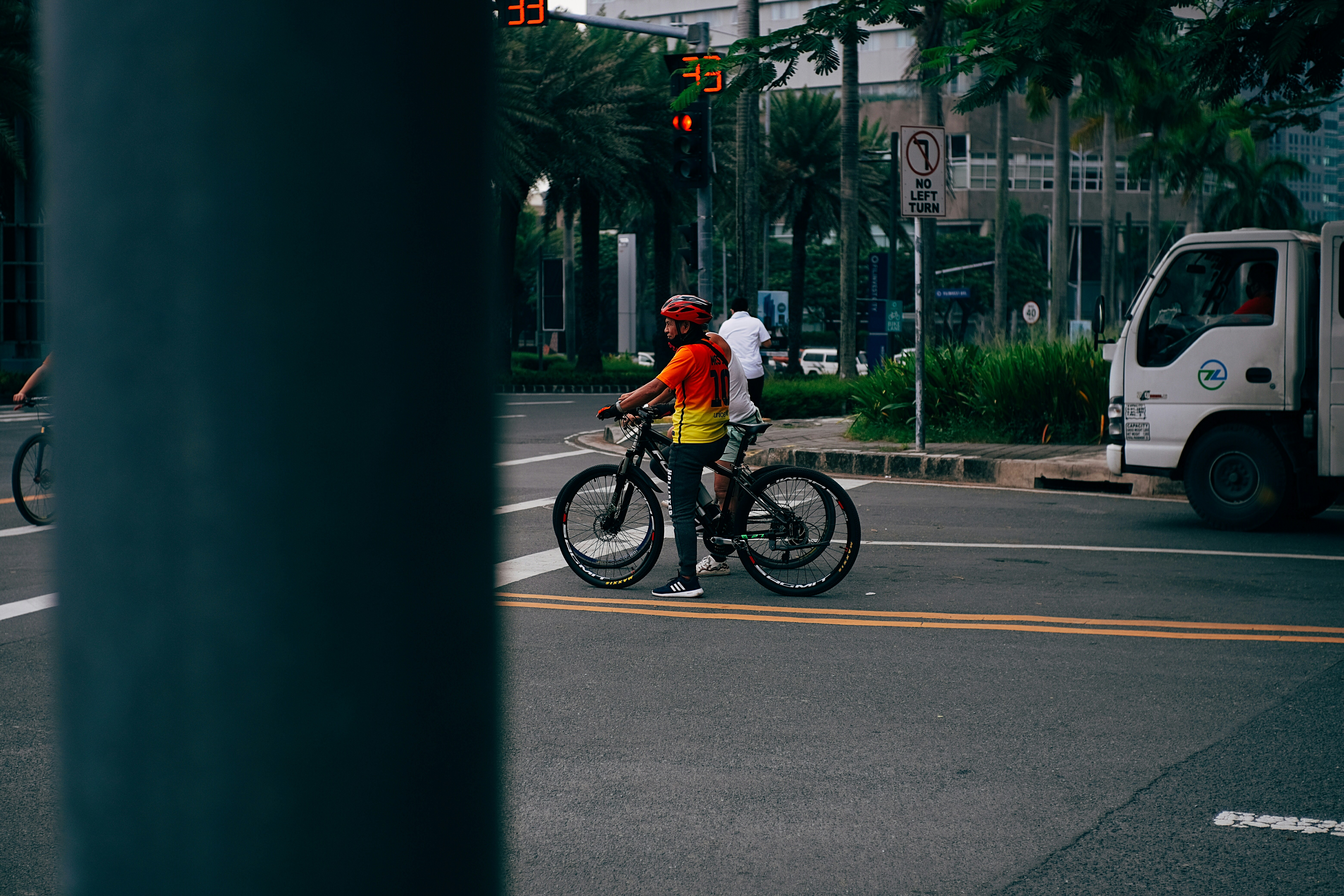 Person on a bike waiting at the traffic light in Metro Manila